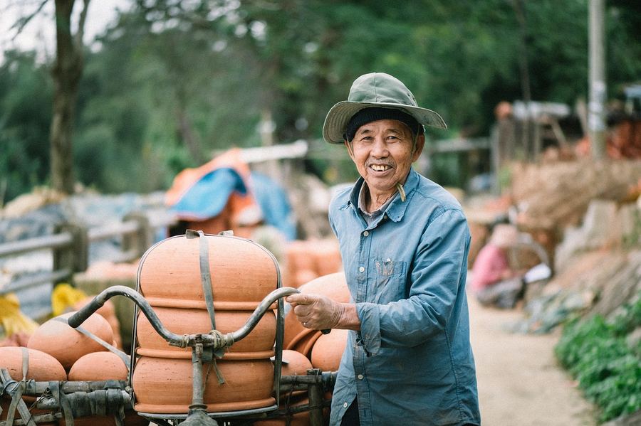 Local Vietnamese tour guide smiling with travelers