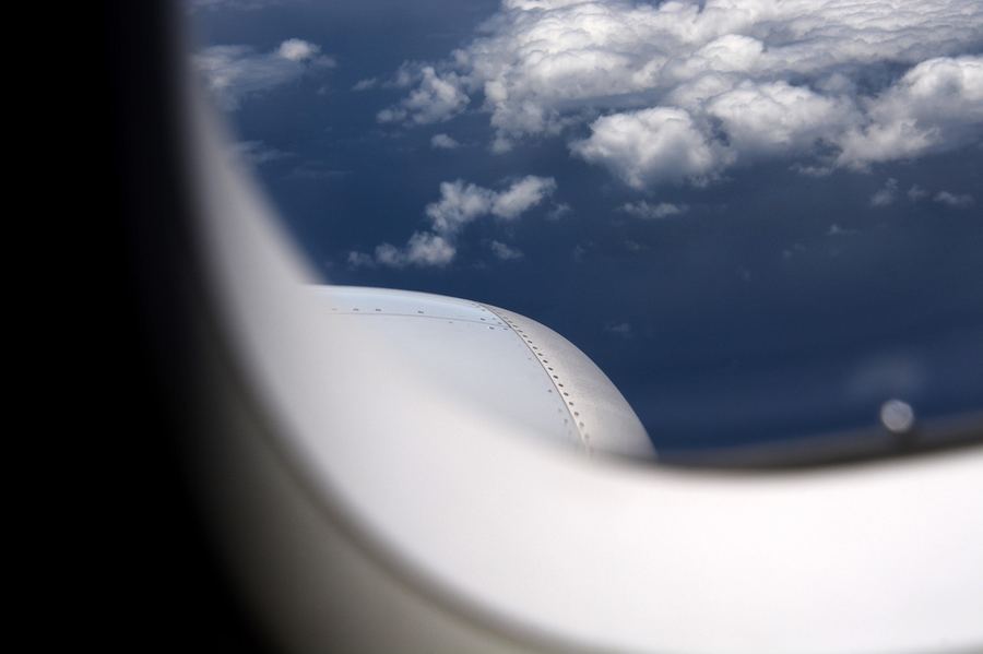 Airplane in the sky representing travel to Vietnam