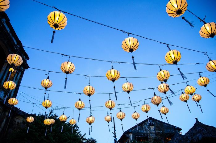 Colorful lanterns hanging in Hoi An ancient town at dusk